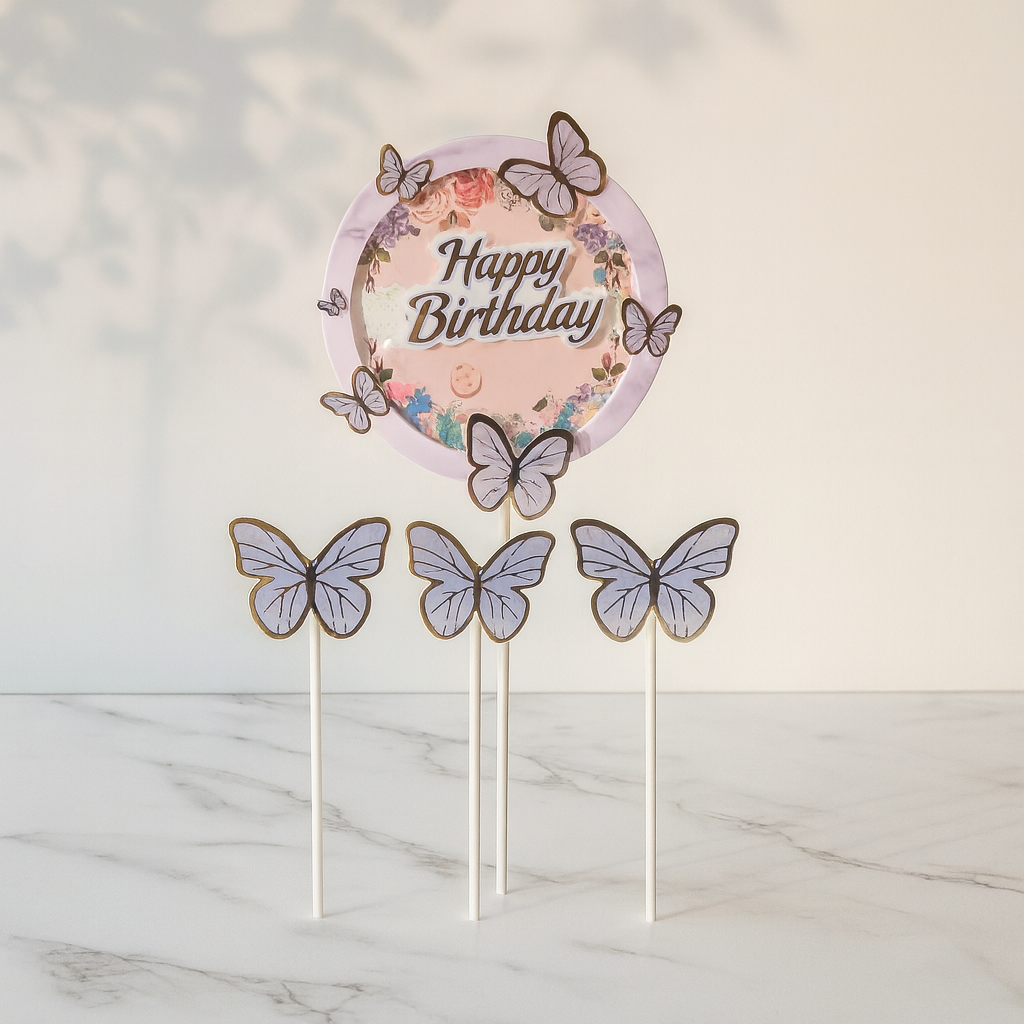Butterfly-themed Happy Birthday cake topper on a marble surface