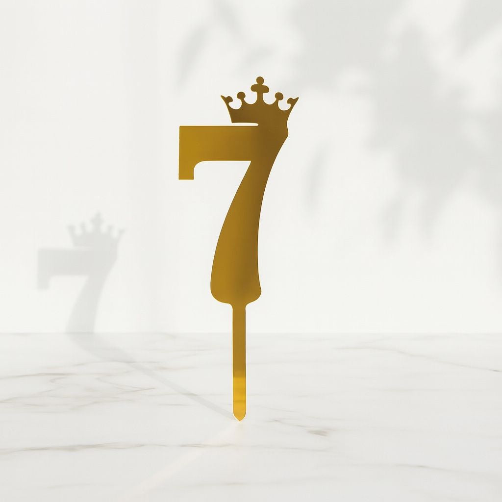 Gold number '7' with a crown on a white background